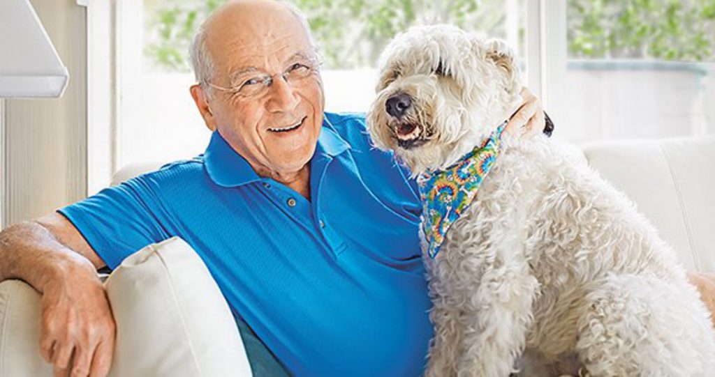 a happy man with a dog - Happy funeral bond in Australia